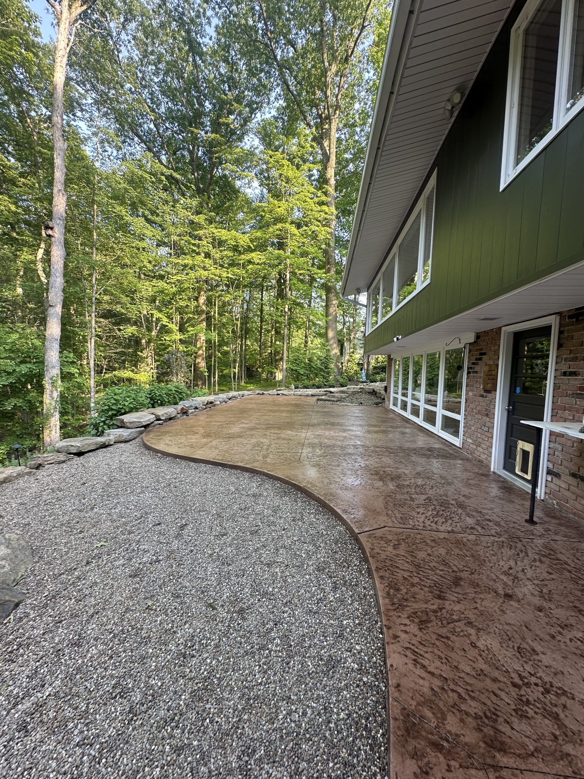 A Front-to-Back Concrete Transformation in Cleveland’s Wooded Suburbs